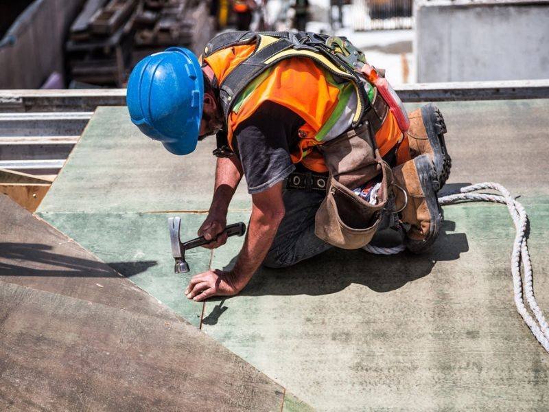 Roofer working on a house