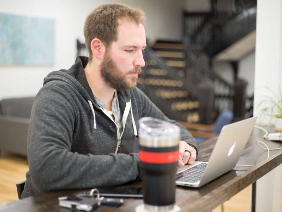 SEO consultant working on a laptop