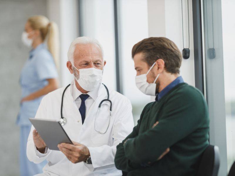 Doctor and nurse with a patient