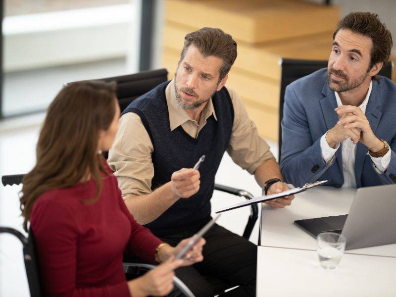 Consultant leading a team meeting