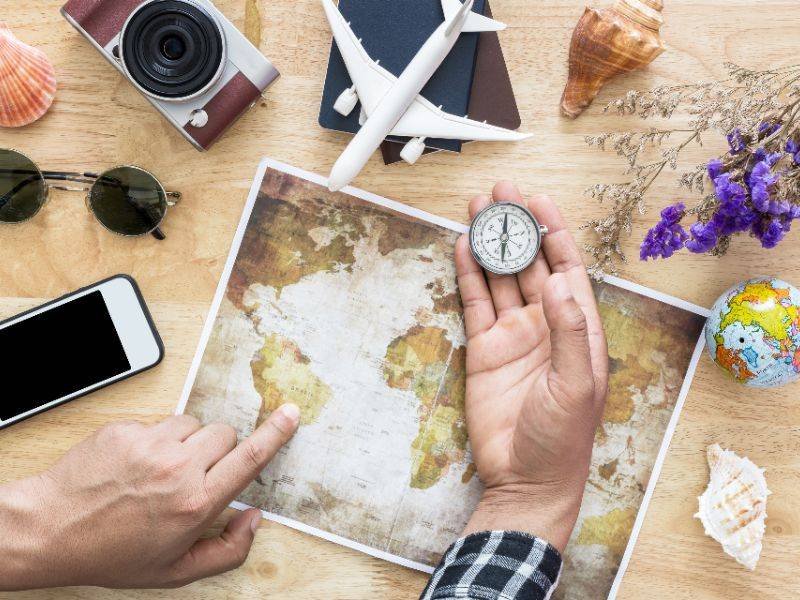 Planning a trip with a map and travel items