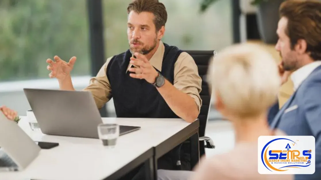 Best CRM for Small Business: How to Choose the Right One in 2026 1 A small sales team in a meeting with a laptop open on the table